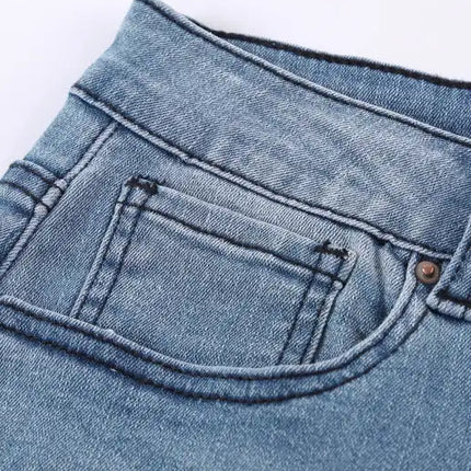 Vaqueros clásicos de talle medio, rasgados, ajustados y lavados 