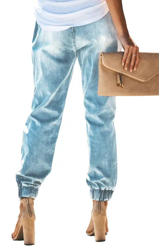 Vaqueros de mujer con cintura elástica con cordón rasgado y lavados 