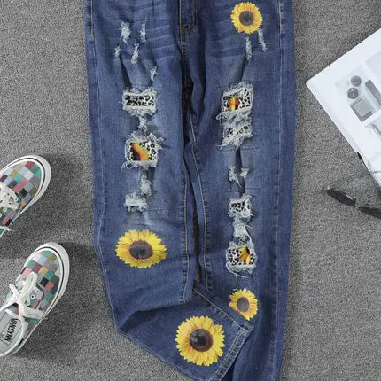 Jeans de cintura alta desgastados con estampado de girasol y patchwork de leopardo 