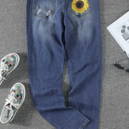 Jeans de cintura alta desgastados con estampado de girasol y patchwork de leopardo 