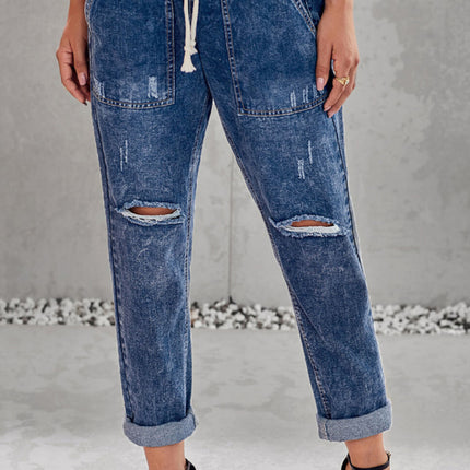 Jogger de mezclilla con bolsillos desgastados y cordón ajustable desgastado 