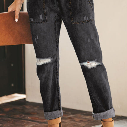 Jogger de mezclilla con bolsillos desgastados y cordón ajustable desgastado 