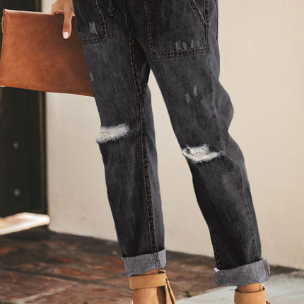 Jogger de mezclilla con bolsillos desgastados y cordón ajustable desgastado 