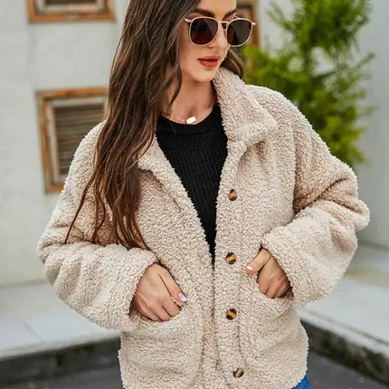 Abrigo de piel suelto de moda de manga larga con bolsillo de un solo pecho con solapa nueva de otoño para mujer 