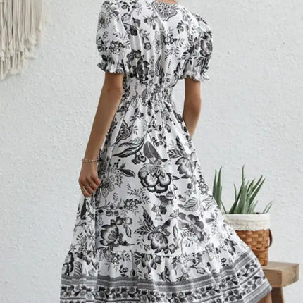 Vestido largo estampado con mangas abullonadas y estampado de posicionamiento en toda la prenda 