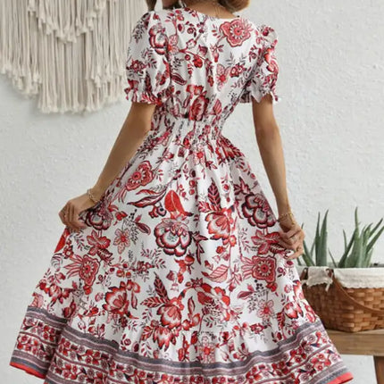 Vestido largo estampado con mangas abullonadas y estampado de posicionamiento en toda la prenda 