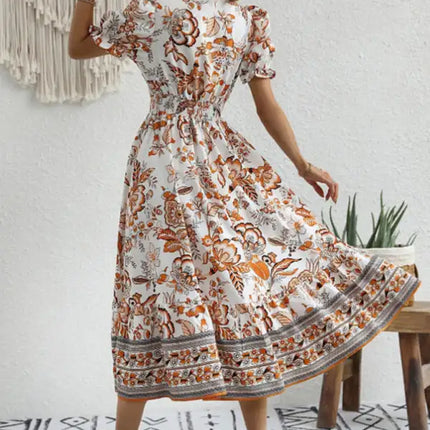 Vestido largo estampado con mangas abullonadas y estampado de posicionamiento en toda la prenda 